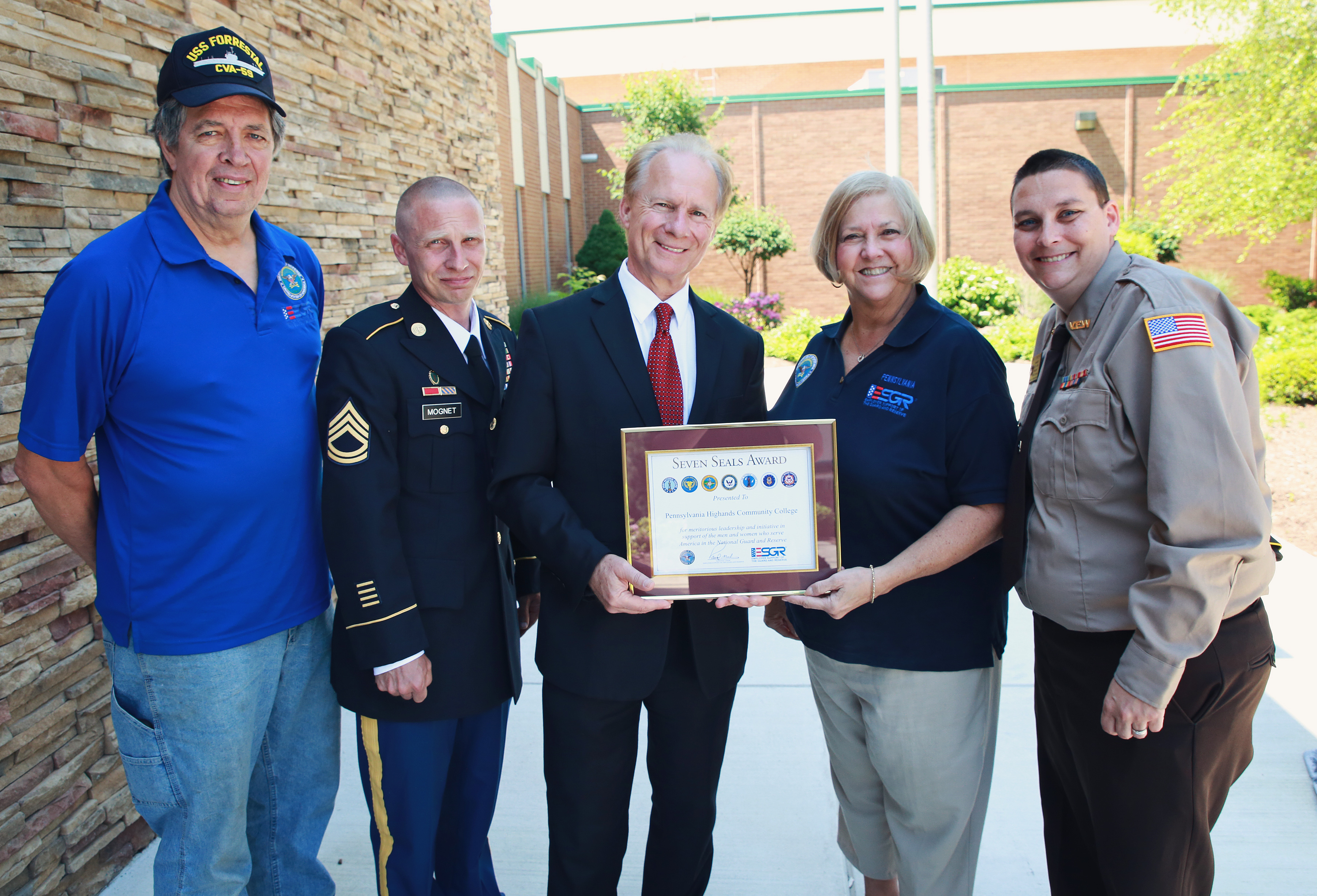 Photo is of the Seven Seals Award presentation. Pictured from left to right: Greg Simmons, ESGR volunteer; Scott Mognet, student and retired from the PA Army National Guard; Dr. Walter Asonevich, College President; Polly Simmons, ESGR volunteer; and Chris Schuerch, student and Windber VFW Post 4795 member.