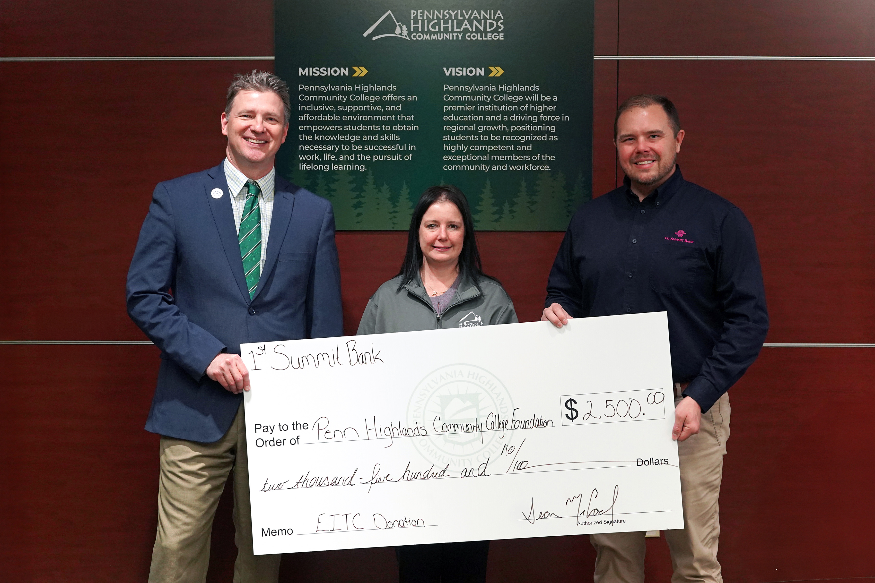 Penn Highlands President Dr. Steve Nunez (left), Director of the College Foundation Carole VanMeter, and 1ST SUMMIT BANK Assistant Vice President & Business Relationship Manager Sean McCool pose for a photo showing the bank’s donation to the College Foundation on Tuesday, December 16, 2025.