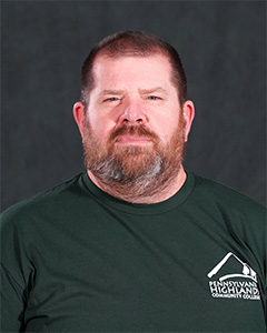 Headshot of Penn Highlands assistant wrestling coach Ron Kakabar