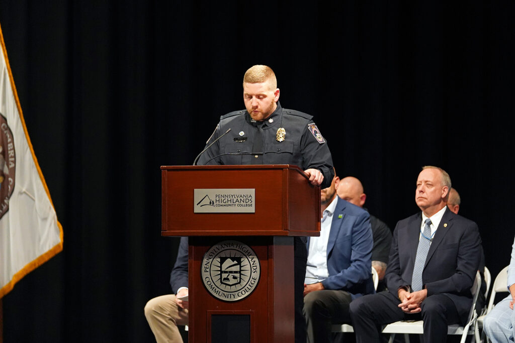 Cadet talking at graduation ceremony.