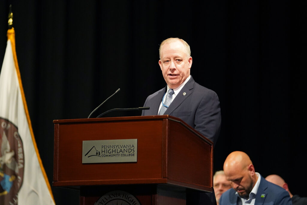 Speaker talking at graduation ceremony.