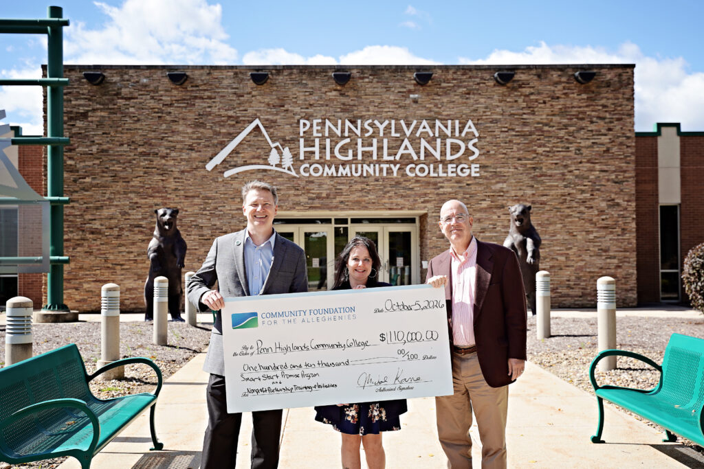 (Left to Right) Dr. Steve Nunez, President of the College, Carole Van Meter, Director of the College Foundation, and Mike Kane, President of the Community Foundation for the Alleghenies, stand together outside of the College’s Richland Campus, showcasing a large check representing the combined total of both grant awards.