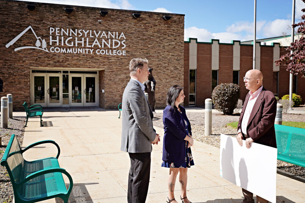 Dr. Steve Nunez, President of the College, Carole Van Meter, Director of the College Foundation, and Mike Kane, President of the Community Foundation for the Alleghenies, conversing outside of the College’s Richland Campus.