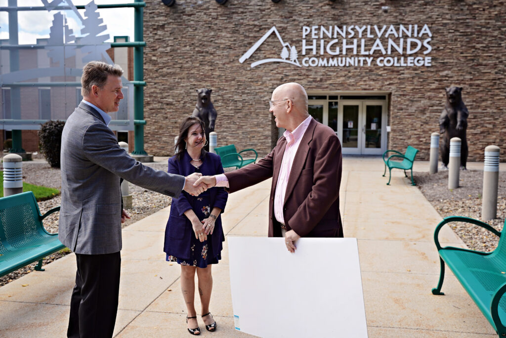(Left to Right) Dr. Steve Nunez, President of the College, shaking hands with Mike Kane, President of the Community Foundation for the Alleghenies, outside of the College’s Richland Campus.